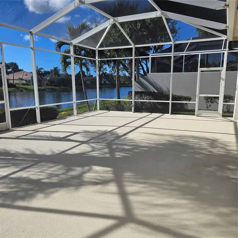 13415 Coluccio Street Venice, FL 34293 - Photo 26 of 39 a view of an empty room with wooden floor and windows