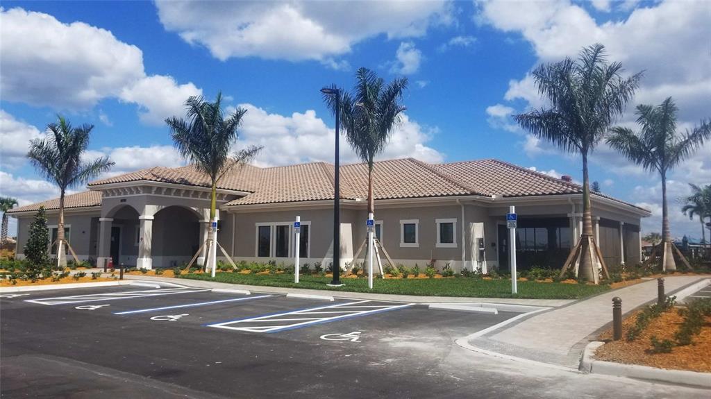 13415 Coluccio Street Venice, FL 34293 - Photo 29 of 39 a view of a big building next to a road