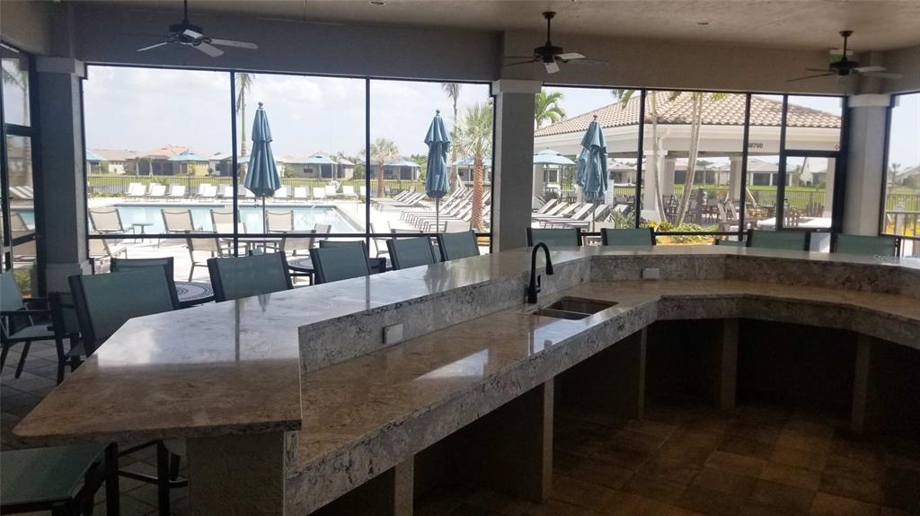 13415 Coluccio Street Venice, FL 34293 - Photo 36 of 39 a dining table with chairs and window