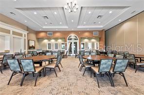 13415 Coluccio Street Venice, FL 34293 - Photo 37 of 39 a view of a dining room with furniture and chandelier