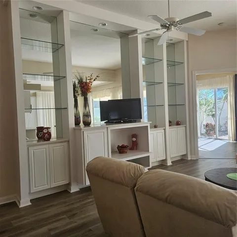 a view of a glass door with a glass door and a room next to a window