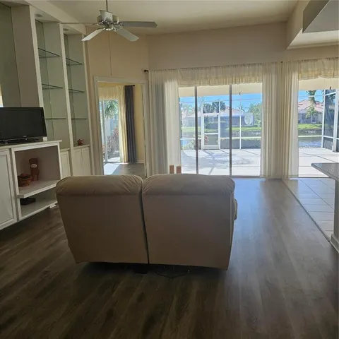 a kitchen with cabinets and white appliances