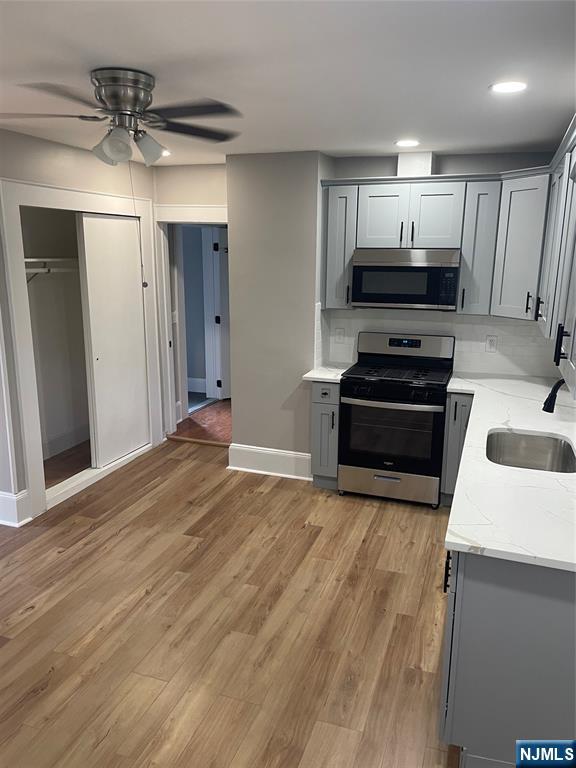 508 2nd Street, Unit 1 Carlstadt, NJ 07072 - Photo 23 of 41 a kitchen with stainless steel appliances a stove a refrigerator and a sink
