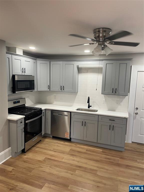 508 2nd Street, Unit 1 Carlstadt, NJ 07072 - Photo 24 of 41 a large kitchen with cabinets wooden floor and stainless steel appliances
