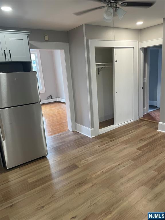 508 2nd Street, Unit 1 Carlstadt, NJ 07072 - Photo 25 of 41 an empty room with wooden floor and a refrigerator