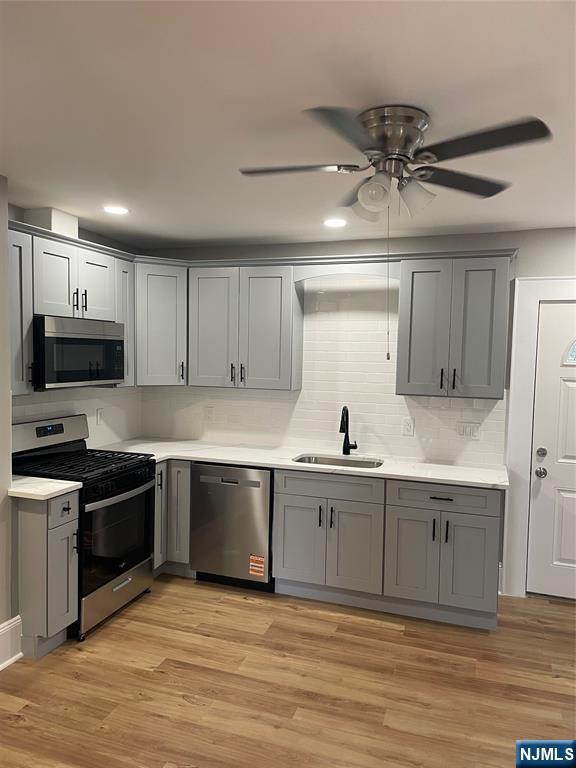 508 2nd Street, Unit 1 Carlstadt, NJ 07072 - Photo 29 of 41 a kitchen with stainless steel appliances granite countertop a sink and stove top oven