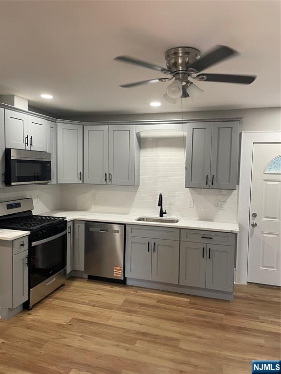 508 2nd Street, Unit 1 Carlstadt, NJ 07072 - Photo 30 of 41 a kitchen with stainless steel appliances granite countertop a sink and a stove top oven