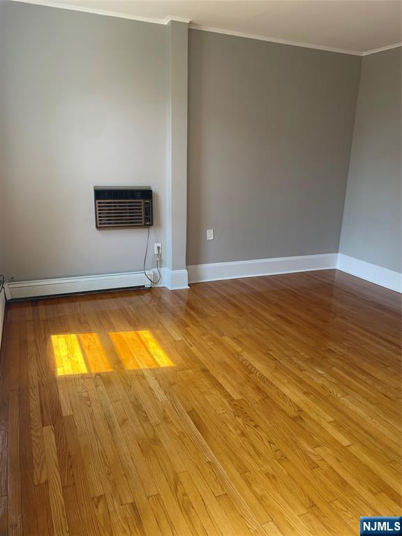 508 2nd Street, Unit 1 Carlstadt, NJ 07072 - Photo 3 of 41 a view of empty room with wooden floor and fan