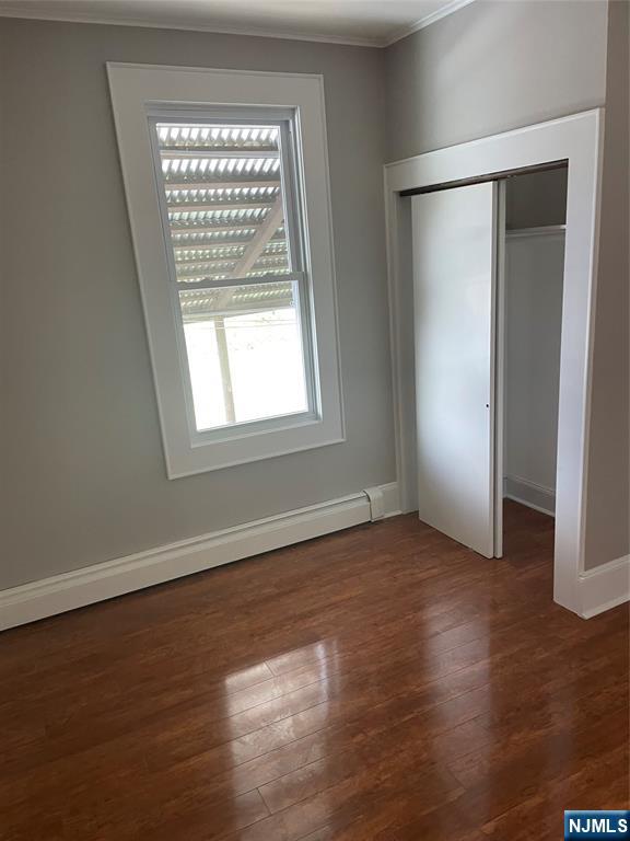 508 2nd Street, Unit 1 Carlstadt, NJ 07072 - Photo 31 of 41 an empty room with wooden floor and windows