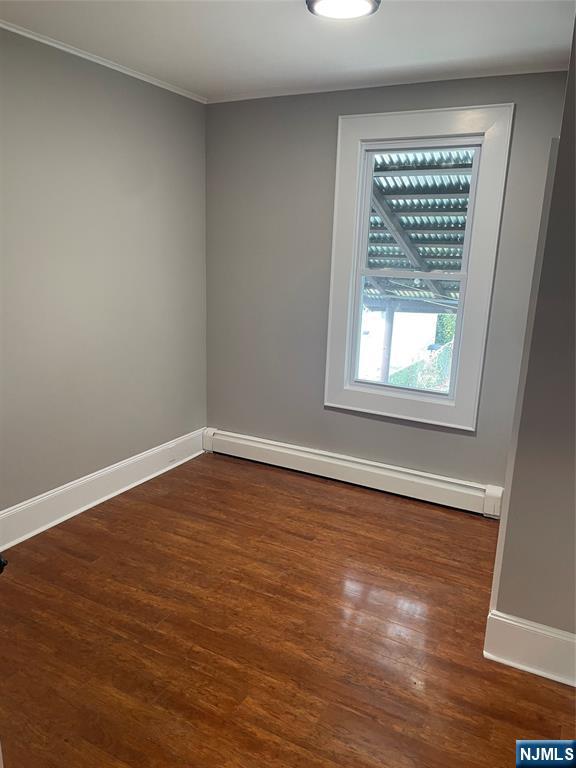 508 2nd Street, Unit 1 Carlstadt, NJ 07072 - Photo 34 of 41 wooden floor in an empty room with a window