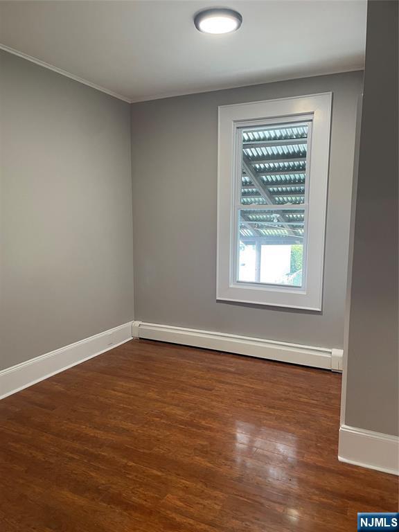 508 2nd Street, Unit 1 Carlstadt, NJ 07072 - Photo 35 of 41 wooden floor in an empty room with a window