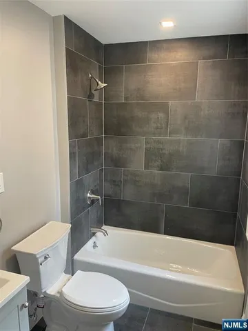 a view of a porch with a table and chairs