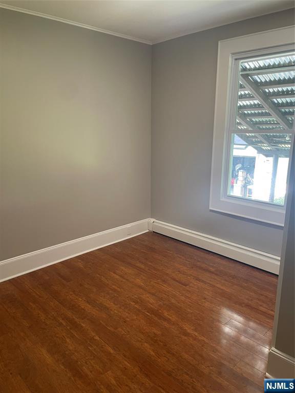508 2nd Street, Unit 1 Carlstadt, NJ 07072 - Photo 9 of 41 a view of an empty room with wooden floor and a window