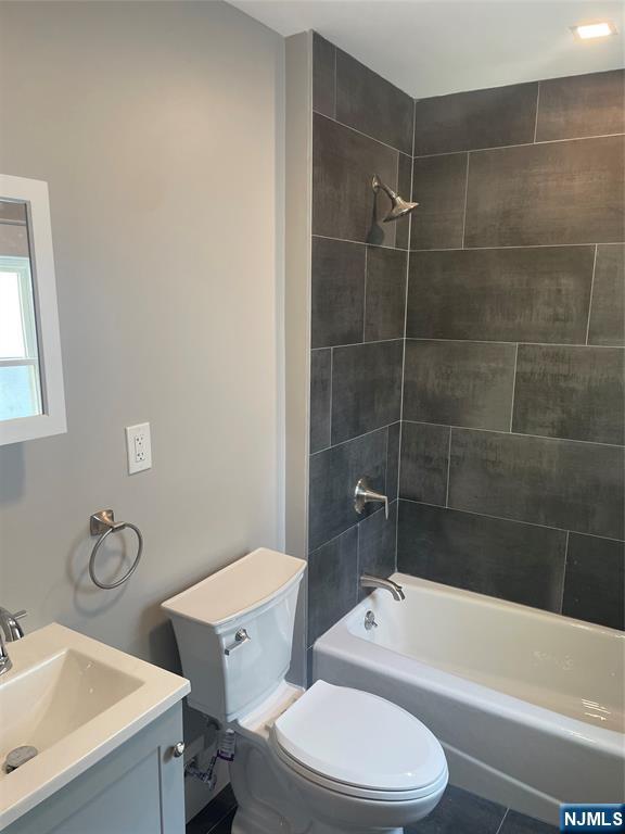 508 2nd Street, Unit 1 Carlstadt, NJ 07072 - Photo 10 of 41 a bathroom with a toilet a sink and bathtub