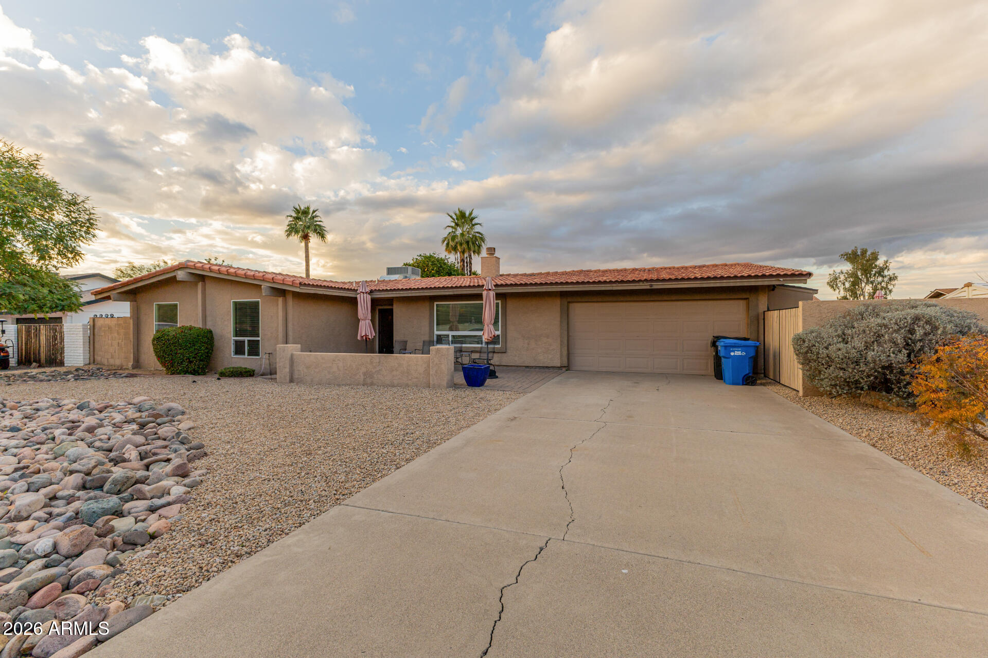 802 West Caribbean Lane Phoenix, AZ 85023 - Photo 13 of 47 a front view of a house with a yard and garage