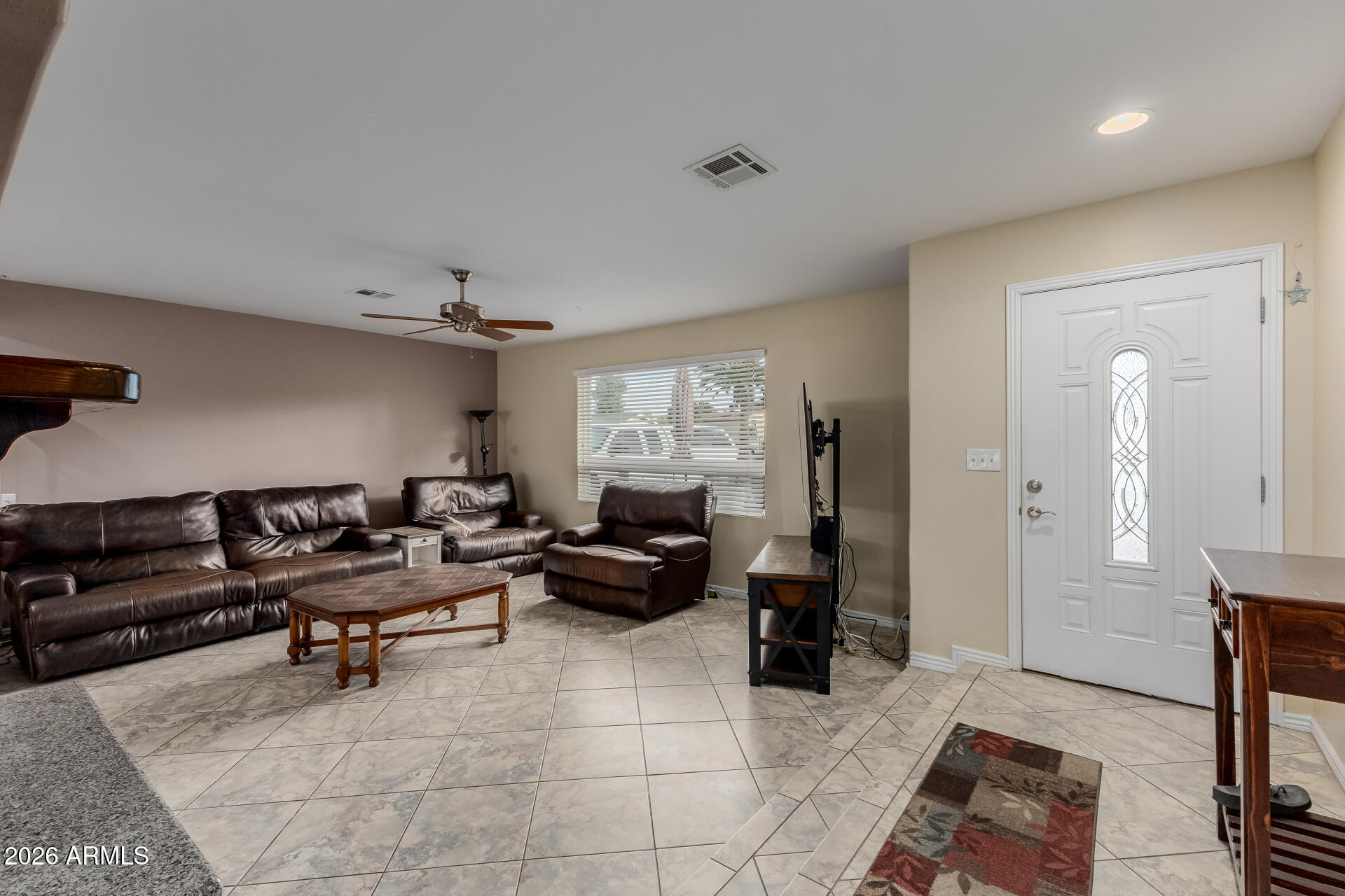 802 West Caribbean Lane Phoenix, AZ 85023 - Photo 16 of 47 a living room with furniture and a window