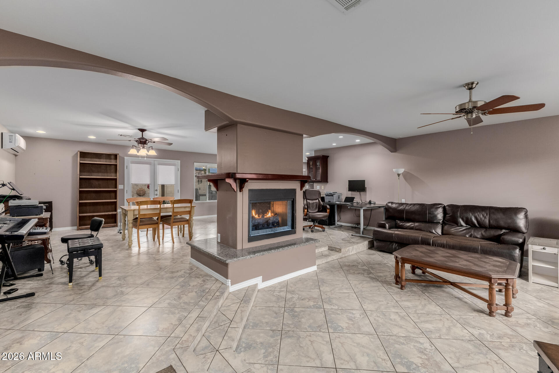 802 West Caribbean Lane Phoenix, AZ 85023 - Photo 17 of 47 a living room with furniture and a fireplace