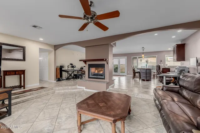 a dining room with furniture and a fireplace
