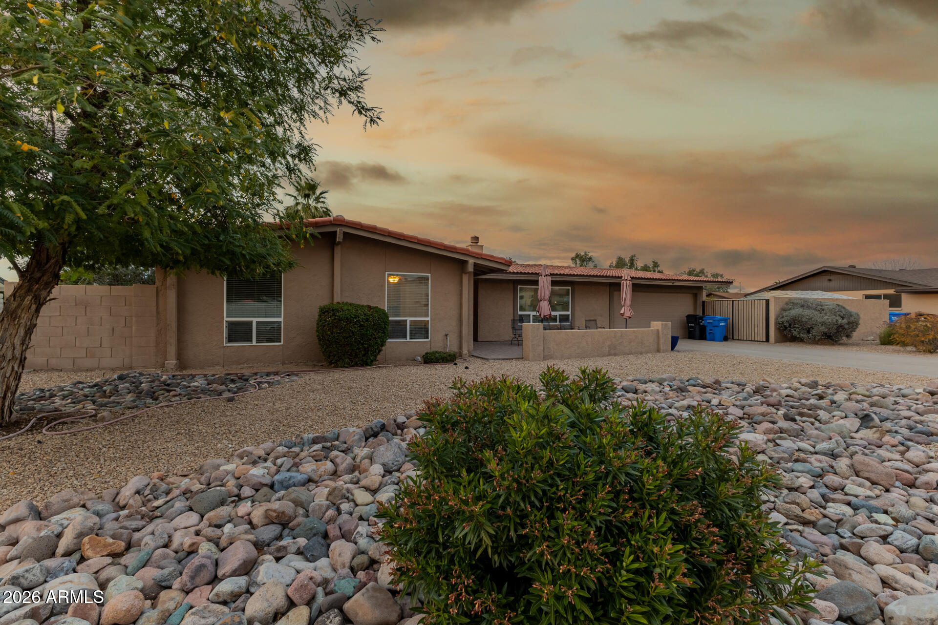 802 West Caribbean Lane Phoenix, AZ 85023 - Photo 2 of 47 a view of a house with a yard and parking space
