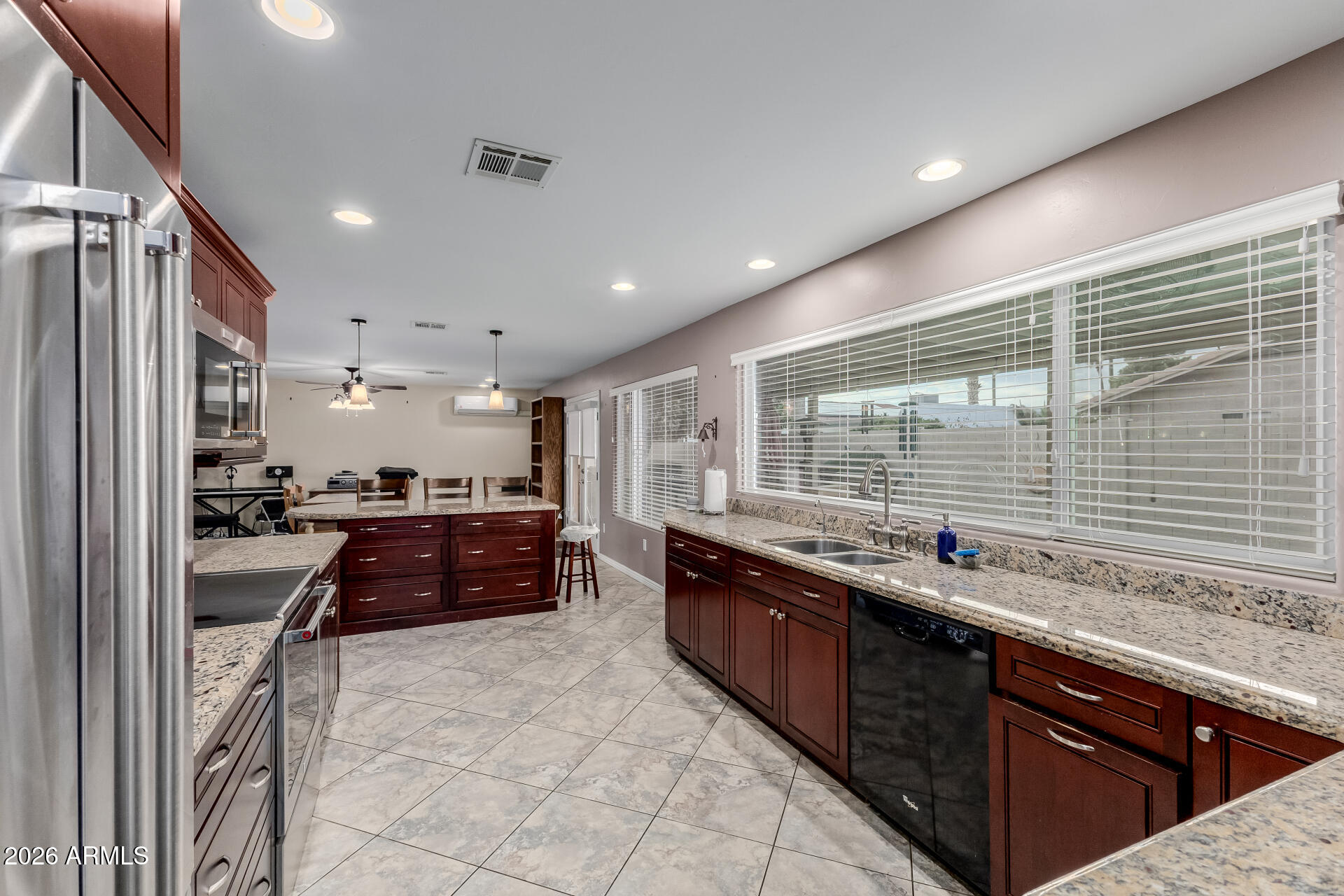 802 West Caribbean Lane Phoenix, AZ 85023 - Photo 24 of 47 a kitchen with stainless steel appliances granite countertop a sink and a stove