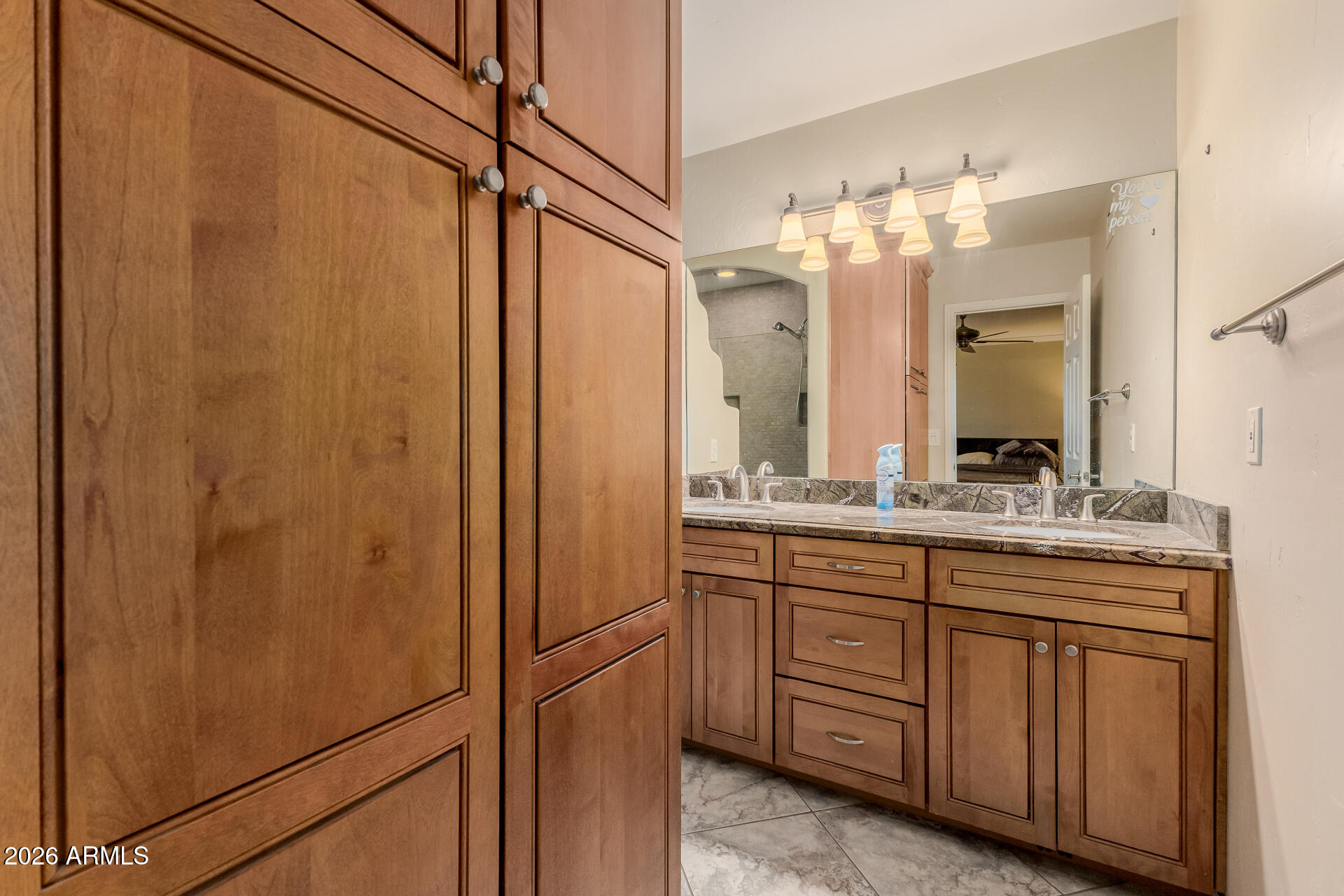 802 West Caribbean Lane Phoenix, AZ 85023 - Photo 27 of 47 a bathroom with a double vanity sink and a mirror