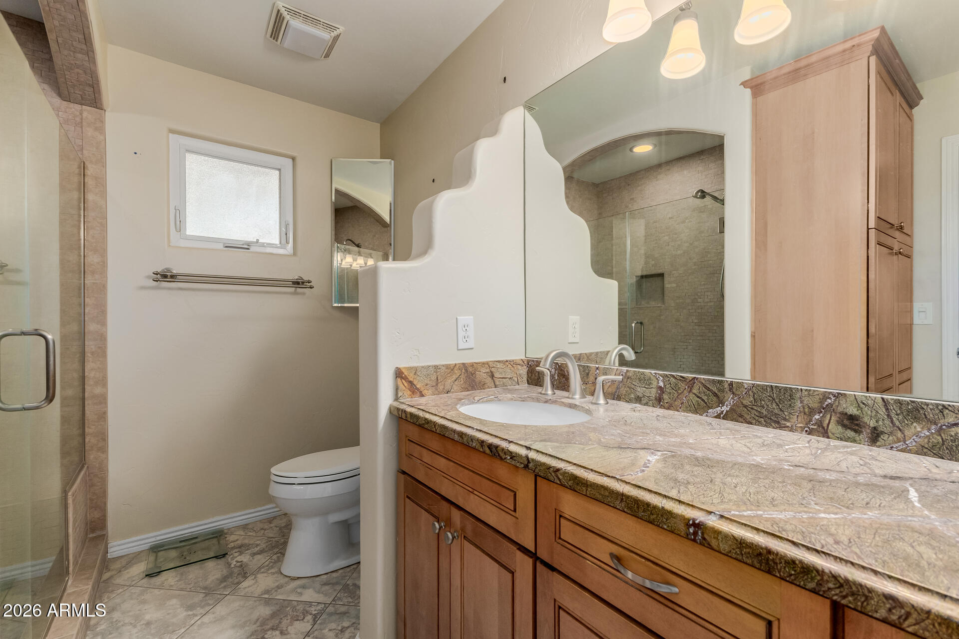 802 West Caribbean Lane Phoenix, AZ 85023 - Photo 28 of 47 a bathroom with a granite countertop sink a toilet and a mirror