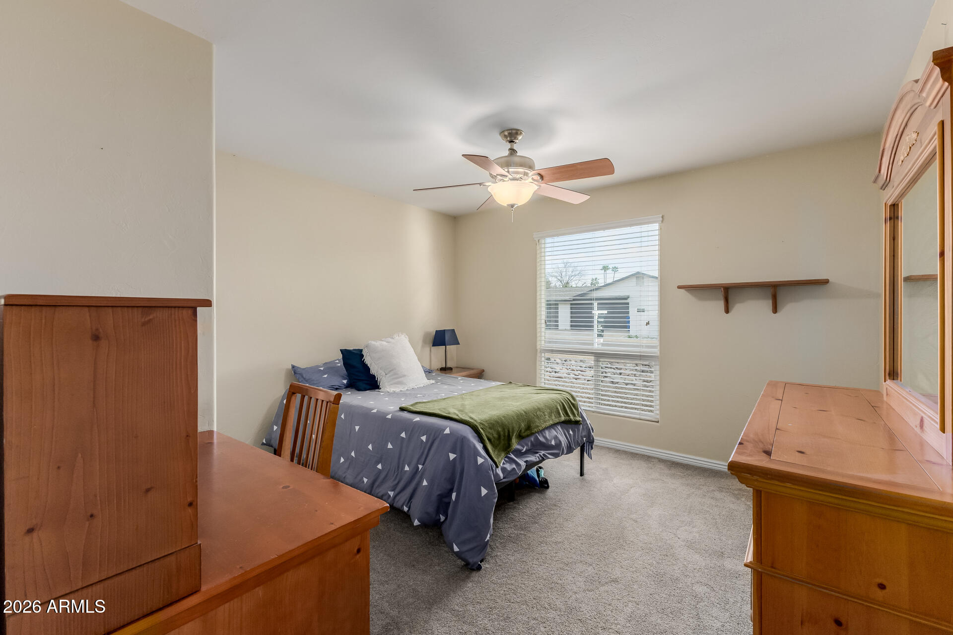 802 West Caribbean Lane Phoenix, AZ 85023 - Photo 33 of 47 a bedroom with a bed and a window