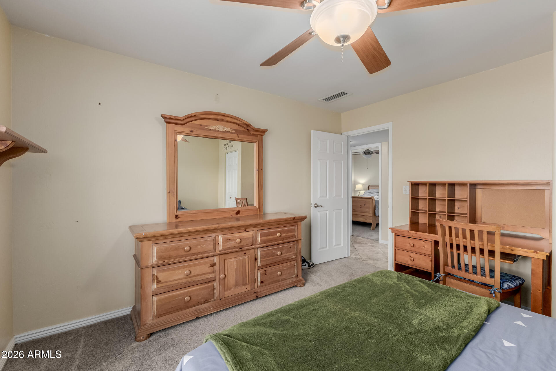 802 West Caribbean Lane Phoenix, AZ 85023 - Photo 34 of 47 a bedroom with a bed and a chandelier