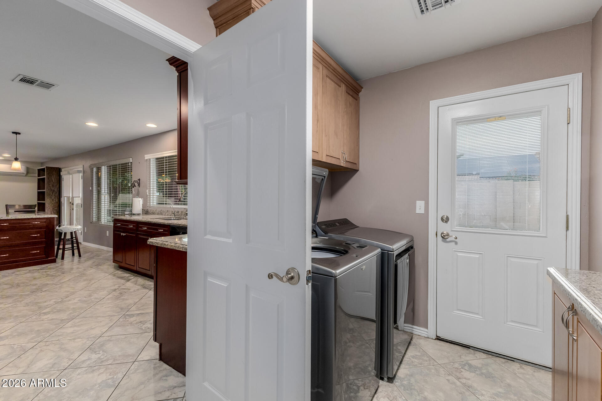 802 West Caribbean Lane Phoenix, AZ 85023 - Photo 36 of 47 a view of a kitchen with refrigerator and windows