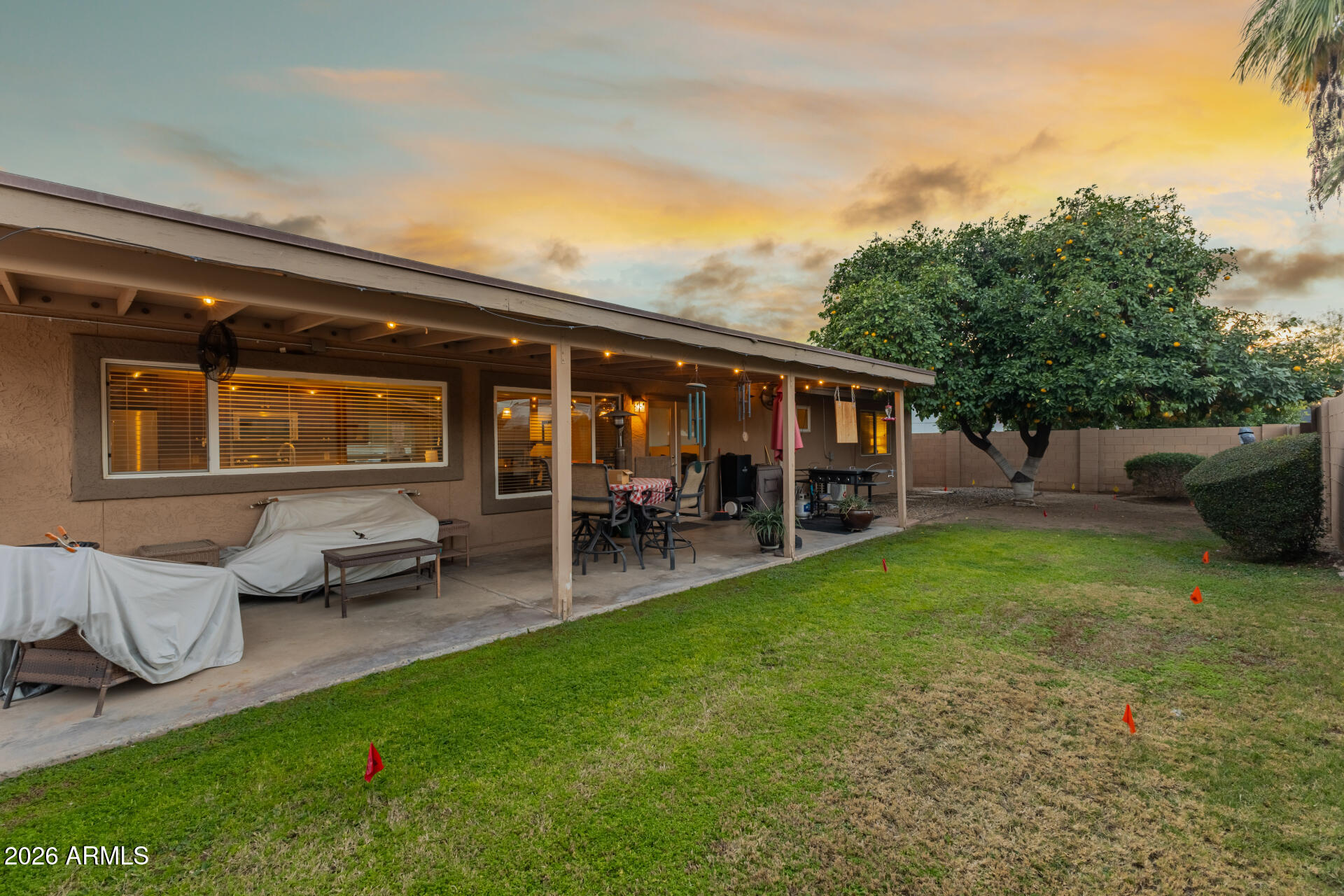 802 West Caribbean Lane Phoenix, AZ 85023 - Photo 37 of 47 a backyard of a house with table and chairs