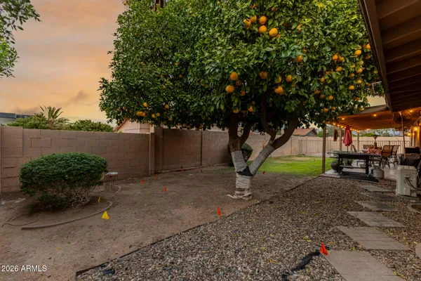 a view of yard with patio