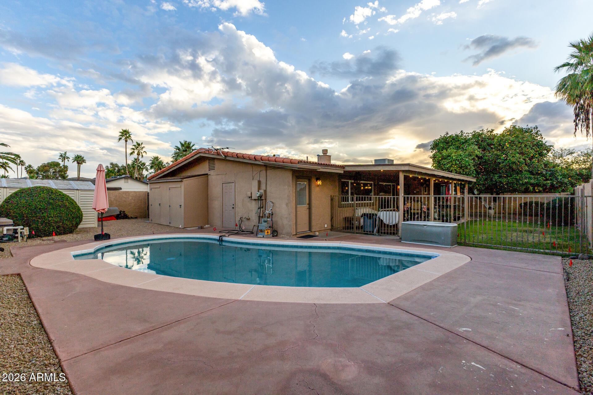 802 West Caribbean Lane Phoenix, AZ 85023 - Photo 45 of 47 a view of backyard with swimming pool and outdoor seating