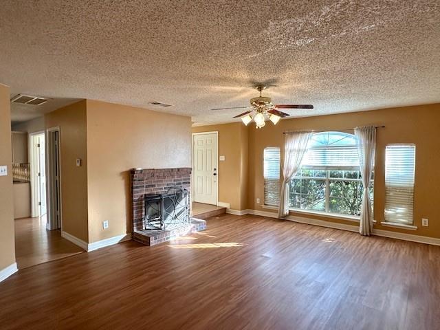 803 Squire Court Allen, TX 75002 - Photo 2 of 16 a view of an empty room with wooden floor and a window