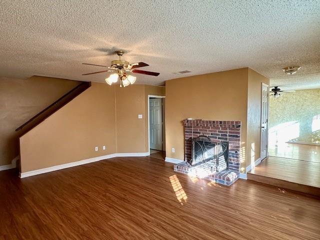 803 Squire Court Allen, TX 75002 - Photo 4 of 16 a view of a livingroom with wooden floor a fireplace and windows