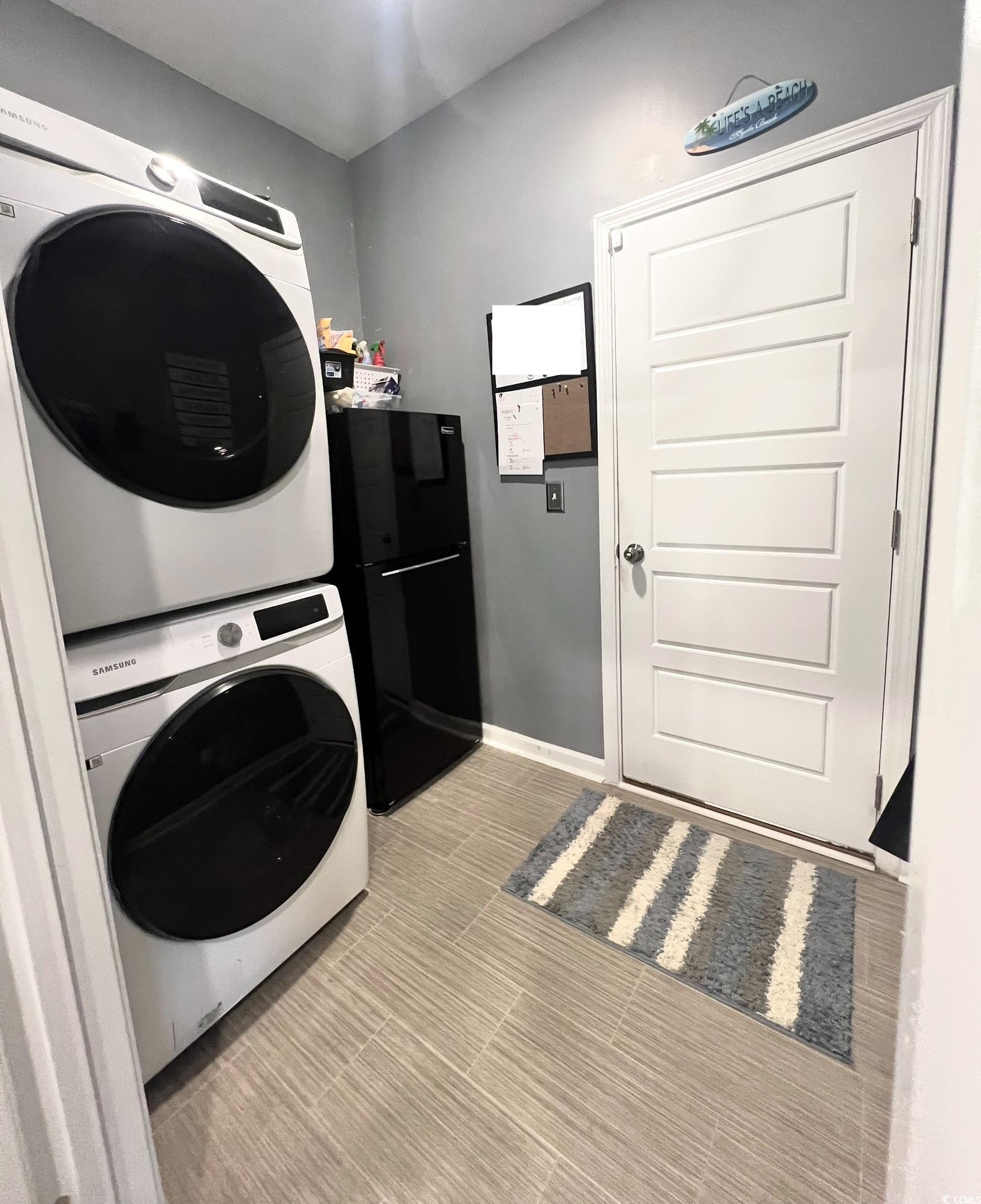 340 North Reindeer Road Surfside Beach, SC 29575 - Photo 34 of 40 Washroom featuring stacked washing maching and dry