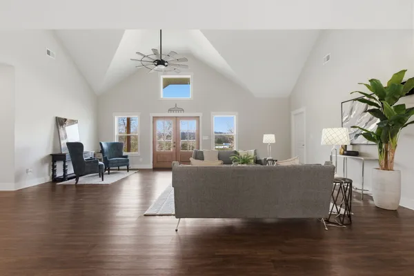 a large kitchen with granite countertop lots of counter space and stainless steel appliances