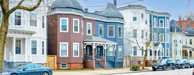 a front view of a brick building with many windows