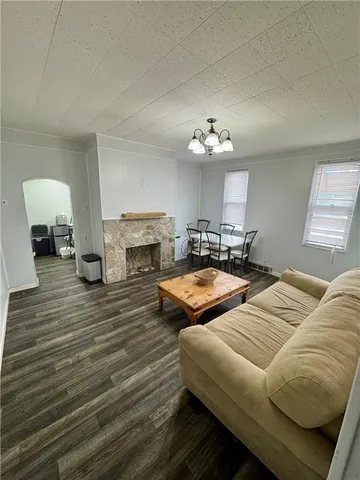 a bedroom with furniture and a fireplace