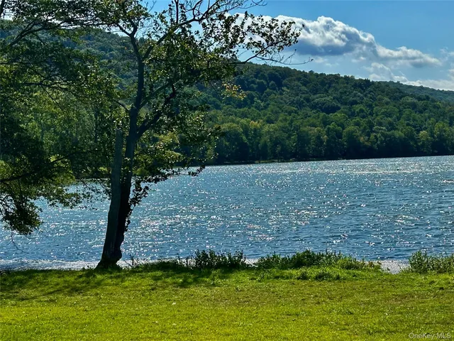 a view of outdoor space with deck and yard