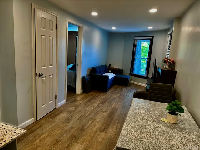 a living room with furniture and a rug