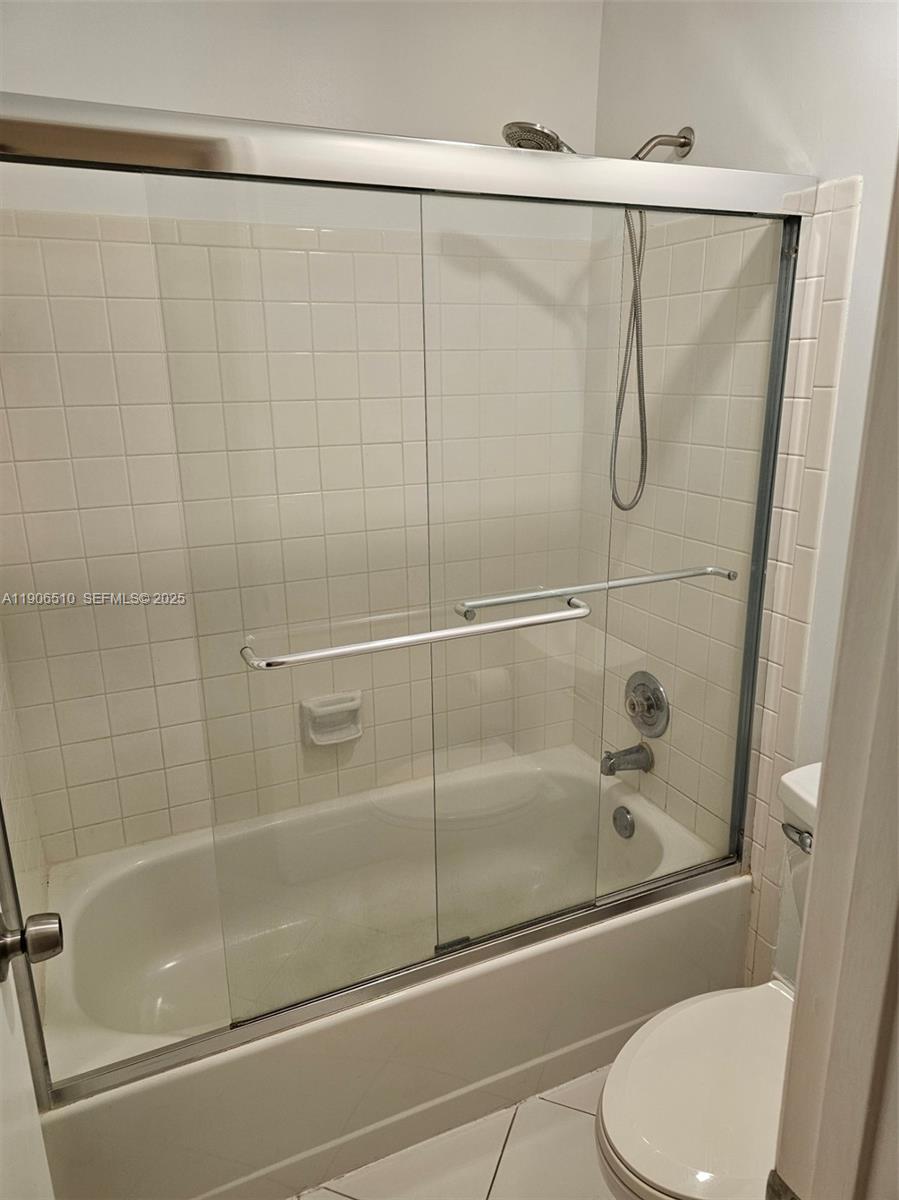 7572 Courtyard Run East Boca Raton, FL 33433 - Photo 11 of 13 a bathroom with a shower and a toilet