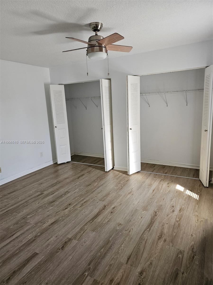 7572 Courtyard Run East Boca Raton, FL 33433 - Photo 8 of 13 a view of a room with wooden floor
