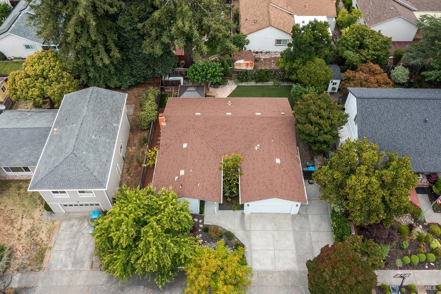 5313 Yerba Buena Road Santa Rosa, CA 95409 - Photo 30 of 34 Aerial view highlights the home's mature landscaping, generous backyard, oversized driveway, and desirable Rincon Valley setting.