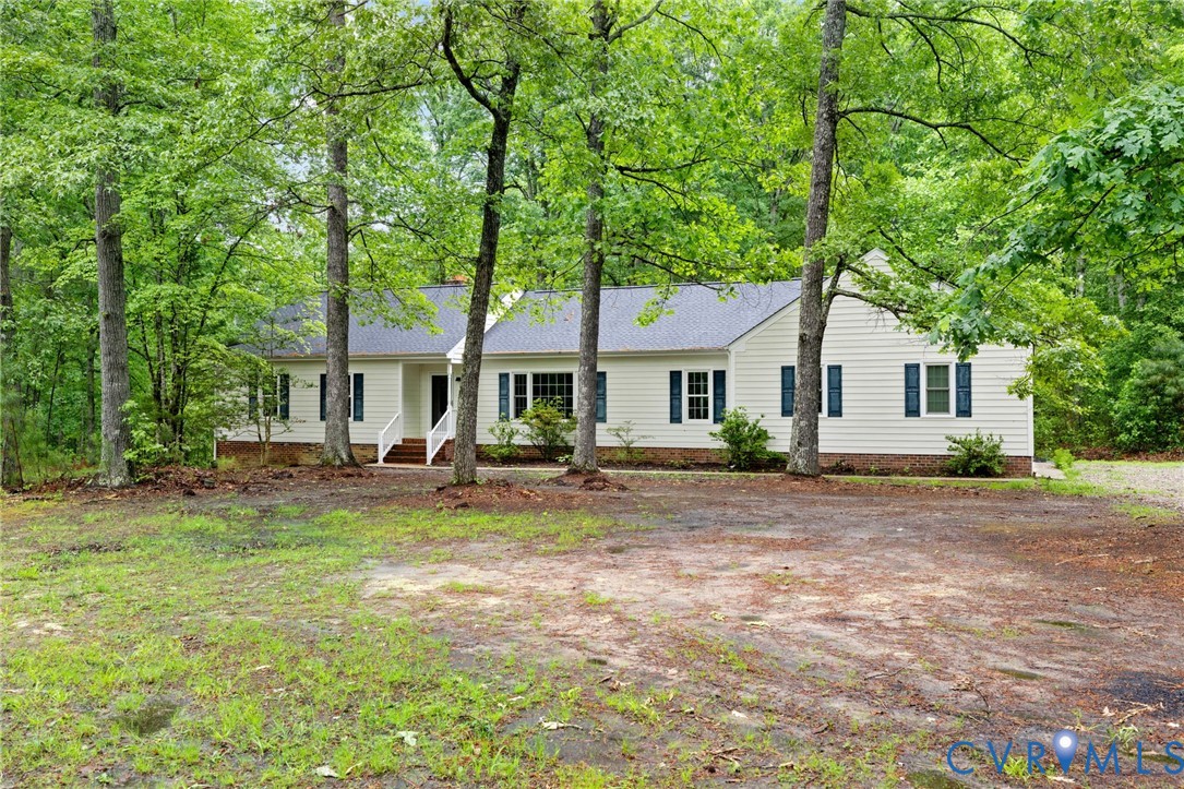 10731 Spring Run Road Chesterfield, VA 23832 - Photo 1 of 33 a view of a house with backyard and sitting area