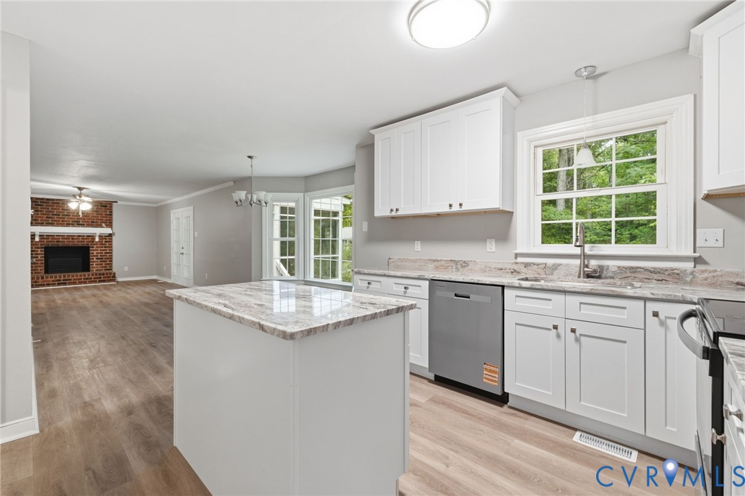 10731 Spring Run Road Chesterfield, VA 23832 - Photo 11 of 33 a kitchen with granite countertop cabinets sink and window
