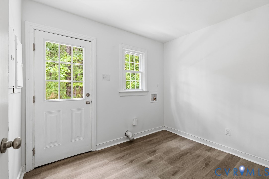 10731 Spring Run Road Chesterfield, VA 23832 - Photo 12 of 33 an empty room with wooden floor and windows