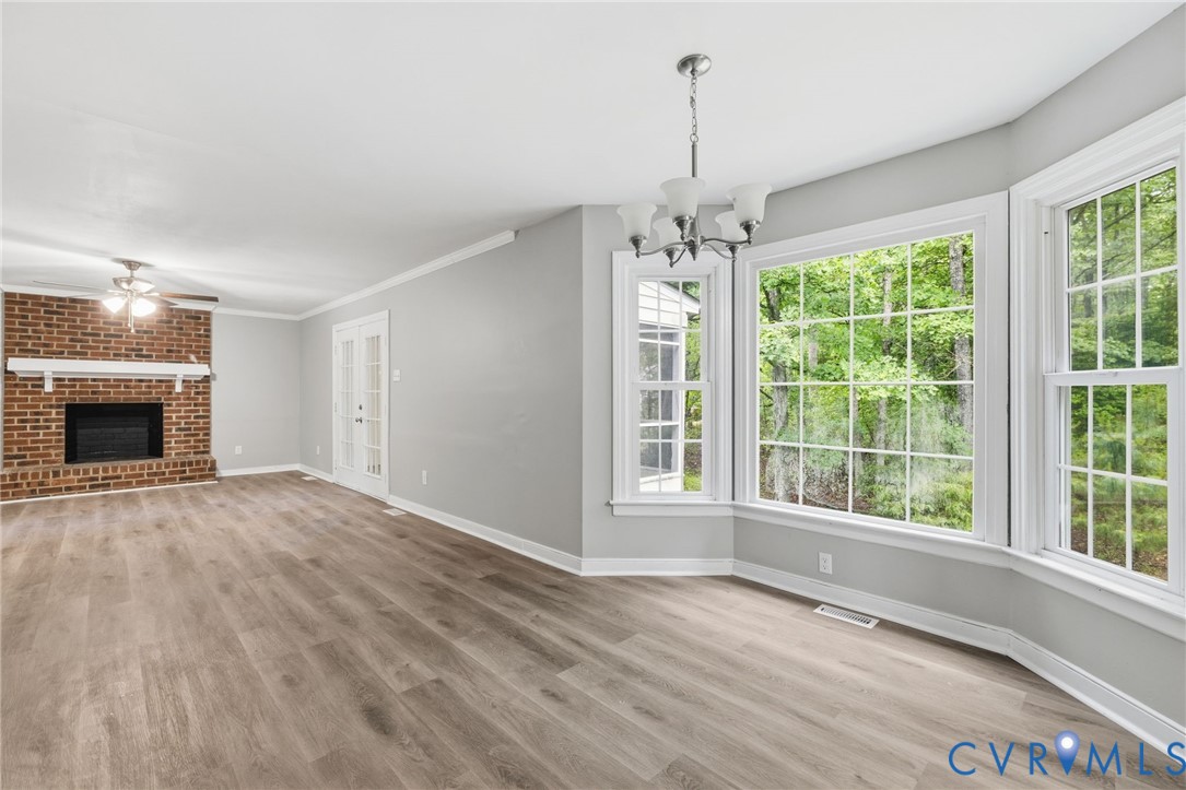 10731 Spring Run Road Chesterfield, VA 23832 - Photo 13 of 33 a view of an empty room with a window and wooden floor