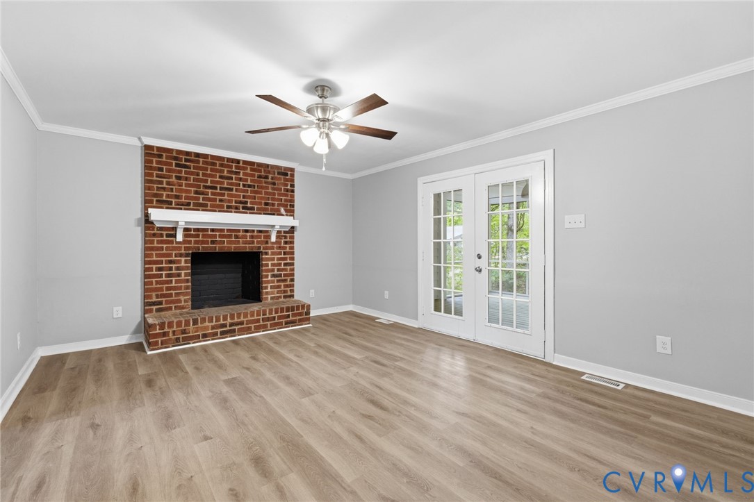 10731 Spring Run Road Chesterfield, VA 23832 - Photo 16 of 33 a view of an empty room with a fireplace and a window