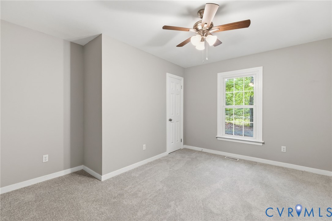 10731 Spring Run Road Chesterfield, VA 23832 - Photo 17 of 33 an empty room with fan and windows