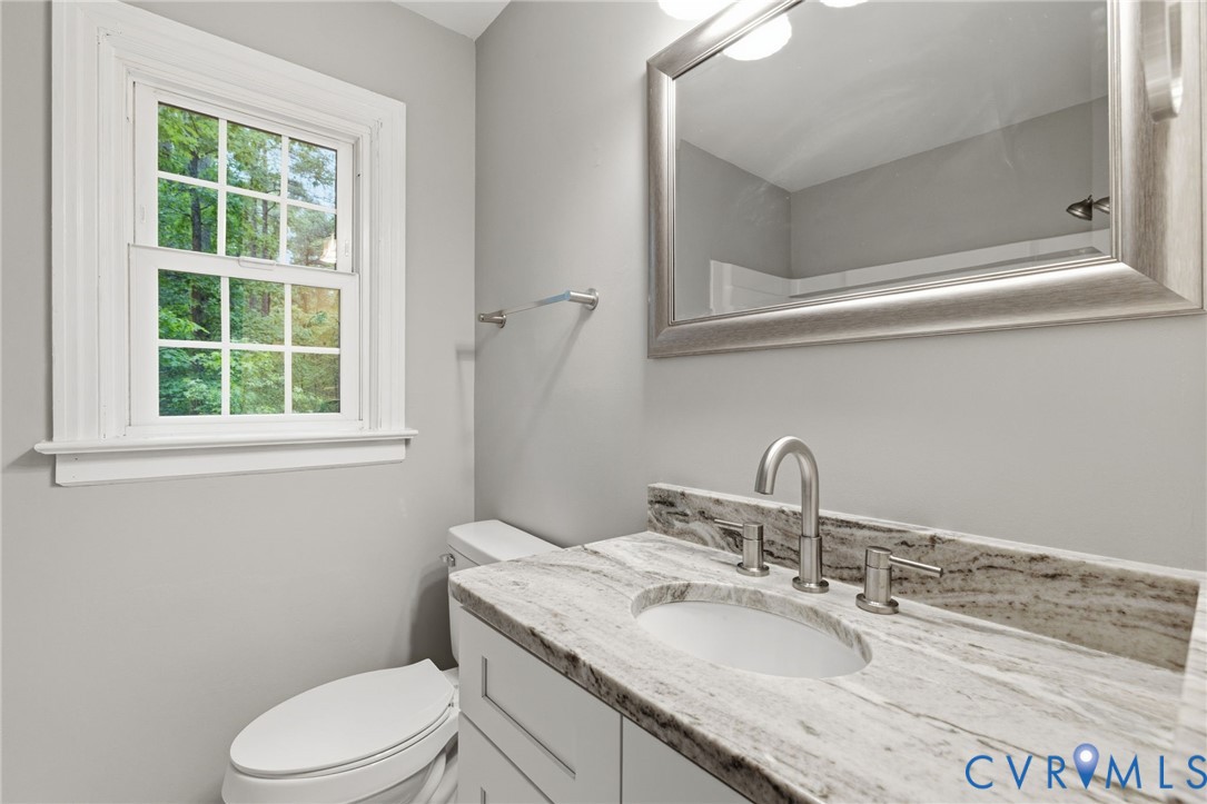10731 Spring Run Road Chesterfield, VA 23832 - Photo 19 of 33 a bathroom with a granite countertop sink toilet and mirror